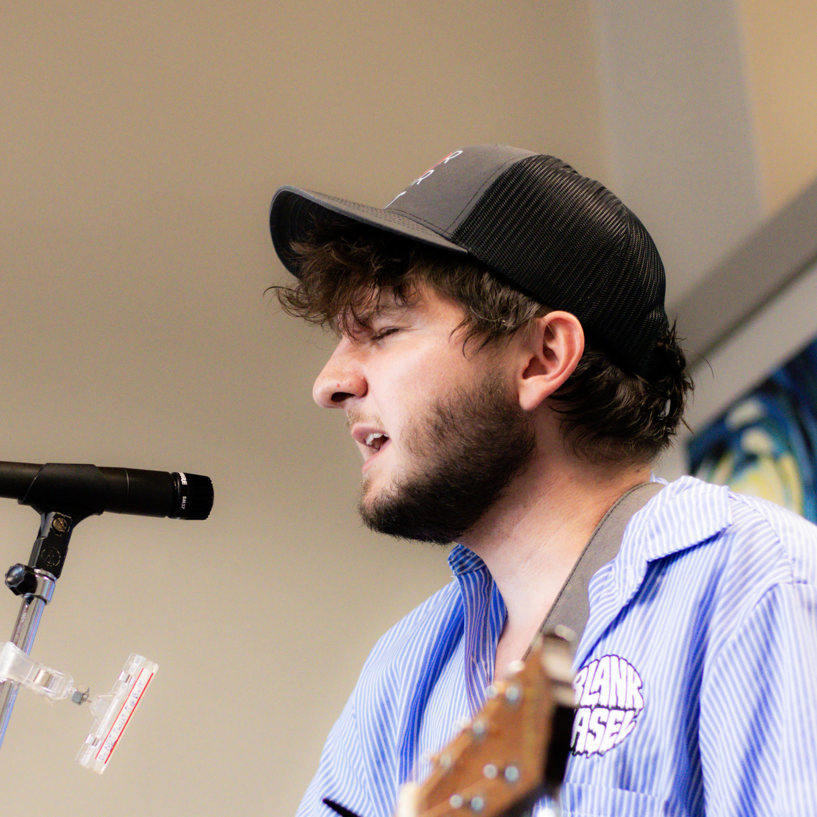 A guitarist performs inside the Blue Cafe.
